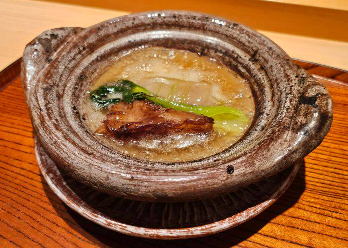 Cantonese-style miniature claypot, featuring simmered beef tongue, winter melon, shark fin and bok choy.